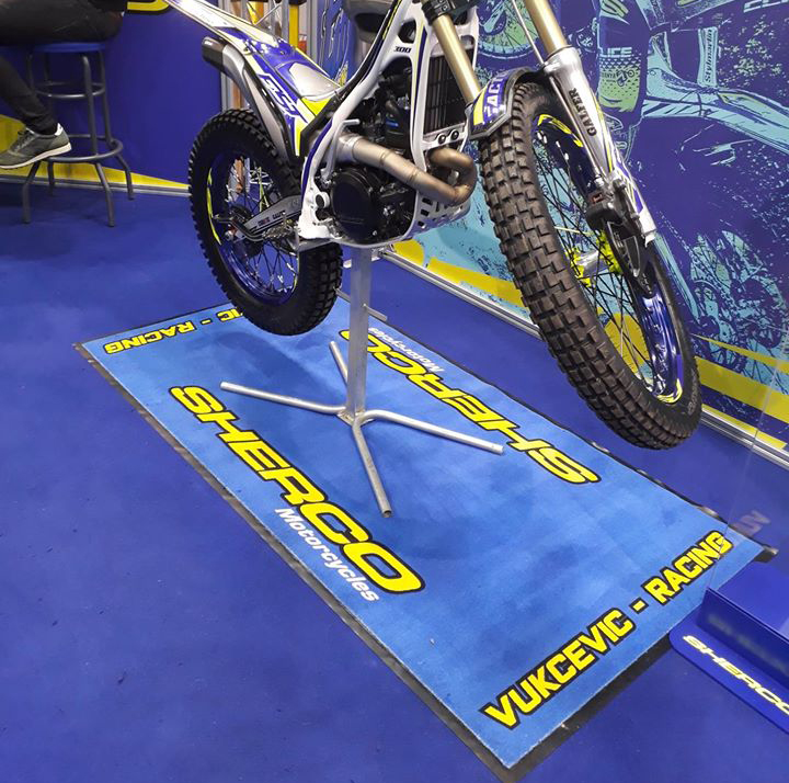 http://www.haonest.com/wp-content/uploads/2021/03/FIM-Approved-Fuel-And-Oil-Resistant-Sherco-Bike-Mat-Motorcycle-Carpet-Mats-Motorcycle-Paddock-Mat.jpg